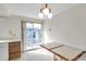 Small dining area with sliding door access to patio at 12400 Park Blvd # 118, Seminole, FL 33772