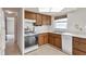 Kitchen with wood cabinets and appliances at 12400 Park Blvd # 118, Seminole, FL 33772