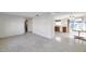 Open living room and kitchen with terrazzo floors at 12400 Park Blvd # 118, Seminole, FL 33772