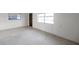 Living room with terrazzo floors and entryway at 12400 Park Blvd # 118, Seminole, FL 33772