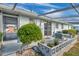 Private patio with lush landscaping and seating area at 12400 Park Blvd # 118, Seminole, FL 33772