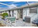 Private patio with table and chairs, perfect for relaxing at 12400 Park Blvd # 118, Seminole, FL 33772