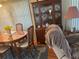 Dining area with wood table and hutch at 12501 Ulmerton Rd # 140, Largo, FL 33774