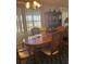 Dining room with wood table and chairs, and hutch at 12501 Ulmerton Rd # 140, Largo, FL 33774