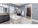 Spa-like bathroom with a large soaking tub and walk-in closet at 13513 White Sapphire Rd, Riverview, FL 33579