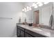 Modern bathroom with double vanity and granite countertop at 13513 White Sapphire Rd, Riverview, FL 33579