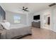 Bright bedroom with a comfortable bed and ensuite bathroom access at 13513 White Sapphire Rd, Riverview, FL 33579