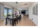 Dining room with a large wooden table and chairs, overlooking the backyard at 13513 White Sapphire Rd, Riverview, FL 33579