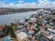 Aerial view of a house by the bay and city at 137 91St Ave, Treasure Island, FL 33706