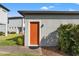 Orange door detached shed with paver walkway at 14115 Indigo Ridge Ln, Lithia, FL 33547