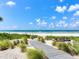 Wooden boardwalk leads to a pristine beach at 1600 Gulf Blvd # 213, Clearwater Beach, FL 33767