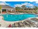Community pool with lounge chairs and a covered patio area at 16023 10Th E Ave, Bradenton, FL 34212