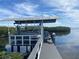 Covered boat dock with lift and open water access at 1643 Sea Breeze Dr, Tarpon Springs, FL 34689