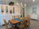 Elegant dining room with a large wooden table and white cabinetry at 1643 Sea Breeze Dr, Tarpon Springs, FL 34689