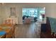 Open concept dining room with views of living room and water at 1643 Sea Breeze Dr, Tarpon Springs, FL 34689