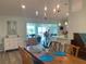 Open concept dining room with water views and chandelier at 1643 Sea Breeze Dr, Tarpon Springs, FL 34689