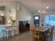 Open concept dining area with a wooden table and kitchen views at 1643 Sea Breeze Dr, Tarpon Springs, FL 34689