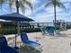 Relaxing patio area with waterfront views and lounge chairs at 1643 Sea Breeze Dr, Tarpon Springs, FL 34689