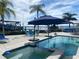 Inviting pool and spa with waterfront view at 1643 Sea Breeze Dr, Tarpon Springs, FL 34689