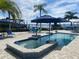 Inviting pool and spa with patio furniture, offering relaxing waterfront views at 1643 Sea Breeze Dr, Tarpon Springs, FL 34689