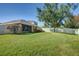 Large backyard with grassy area at 17409 New Cross Cir, Lithia, FL 33547