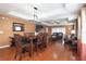 Open concept dining room with hardwood floors and wooden table at 17409 New Cross Cir, Lithia, FL 33547