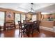 Bright dining room with hardwood floors and modern chandelier at 17409 New Cross Cir, Lithia, FL 33547
