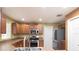 Spacious kitchen with stainless steel appliances and ample counter space at 17409 New Cross Cir, Lithia, FL 33547