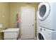 Laundry room with washer, dryer, and sink at 17409 New Cross Cir, Lithia, FL 33547