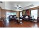 Relaxing living room featuring hardwood floors and comfortable furniture at 17409 New Cross Cir, Lithia, FL 33547