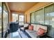 Screened porch with seating and grill at 17409 New Cross Cir, Lithia, FL 33547