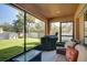 Relaxing screened porch with patio furniture at 17409 New Cross Cir, Lithia, FL 33547