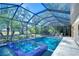 Relaxing screened pool and spa with a covered patio area at 17838 Mission Oak Dr, Lithia, FL 33547