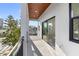 Covered balcony with sliding glass doors leading to interior living space at 18077 3Rd St, Redington Shores, FL 33708