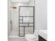 Modern bathroom with frameless shower, floating vanity and stone tile at 18077 3Rd St, Redington Shores, FL 33708