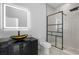 Modern bathroom with a sleek glass shower and a unique vessel sink at 18077 3Rd St, Redington Shores, FL 33708