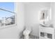 Contemporary powder room with a floating vanity and large mirror at 18077 3Rd St, Redington Shores, FL 33708