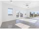 Spacious bedroom featuring hardwood floors and multiple windows with water views at 18077 3Rd St, Redington Shores, FL 33708