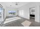 Bright bedroom with sliding glass doors to balcony and hardwood floors at 18077 3Rd St, Redington Shores, FL 33708