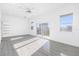 Bright and spacious bedroom with wood-look floors and access to a private balcony at 18077 3Rd St, Redington Shores, FL 33708