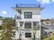 Three-story contemporary home with rooftop deck and balconies at 18077 3Rd St, Redington Shores, FL 33708