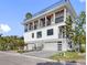 Stunning modern home with three-car garage and multiple balconies at 18077 3Rd E St, Redington Shores, FL 33708