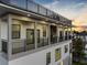 Modern home exterior with balconies and rooftop deck at 18077 3Rd St, Redington Shores, FL 33708