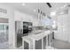 Modern kitchen with stainless steel appliances and white cabinets at 18077 3Rd St, Redington Shores, FL 33708