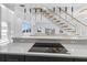 Modern kitchen with island and sleek black cooktop at 18077 3Rd St, Redington Shores, FL 33708