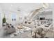 Open living area with modern furniture and a dining table at 18077 3Rd St, Redington Shores, FL 33708