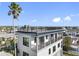 Modern rooftop deck with city views and metal railing at 18077 3Rd St, Redington Shores, FL 33708