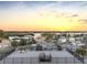Stunning rooftop terrace with sunset views over the neighborhood and water at 18077 3Rd St, Redington Shores, FL 33708