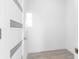 Empty room with white walls and wood-look floors at 18077 3Rd St, Redington Shores, FL 33708