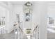 Modern staircase with white railings and wood steps at 18077 3Rd St, Redington Shores, FL 33708